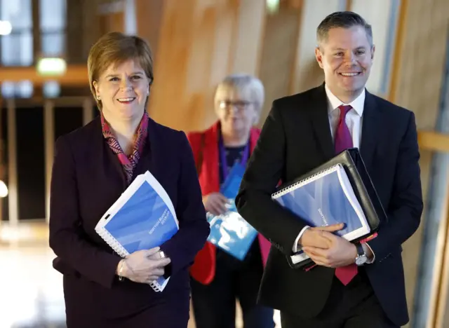 Nicola Sturgeon and Derek Mackay