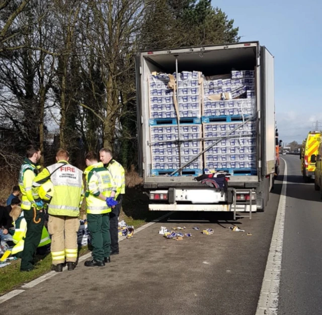 A lorry and firefighters