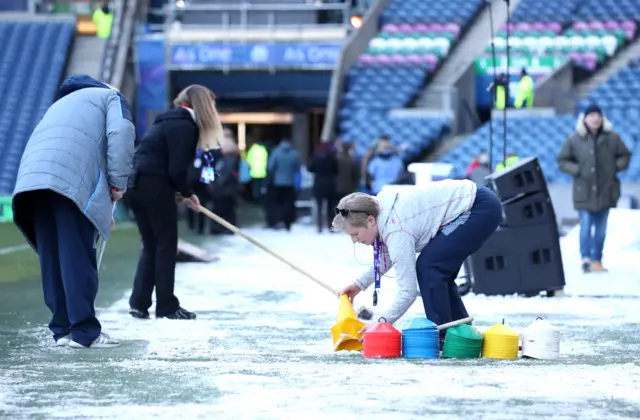 Ground staff clear snow at Murrayfield