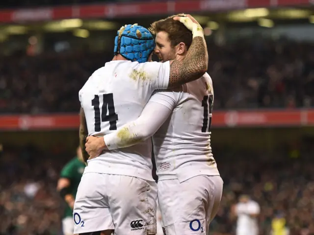 Elliot Daly hugs Jack Nowell to celebrate a try