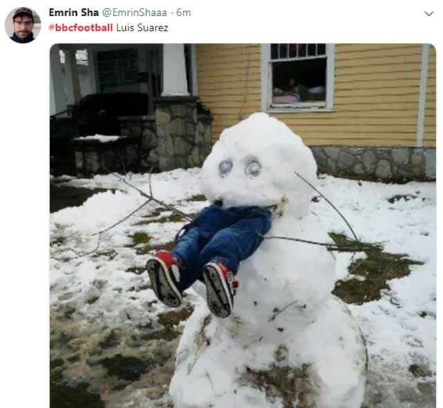 A snowman eating some jeans