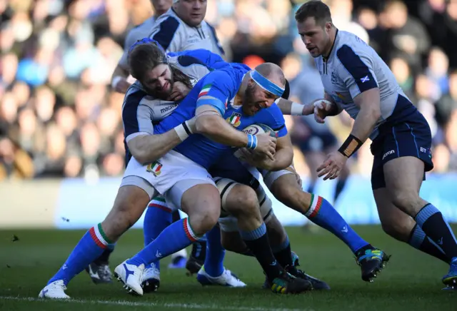 Leonardo Ghiraldini is tackled