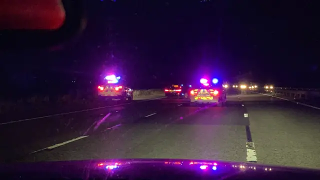 Cars pulled over on motorway