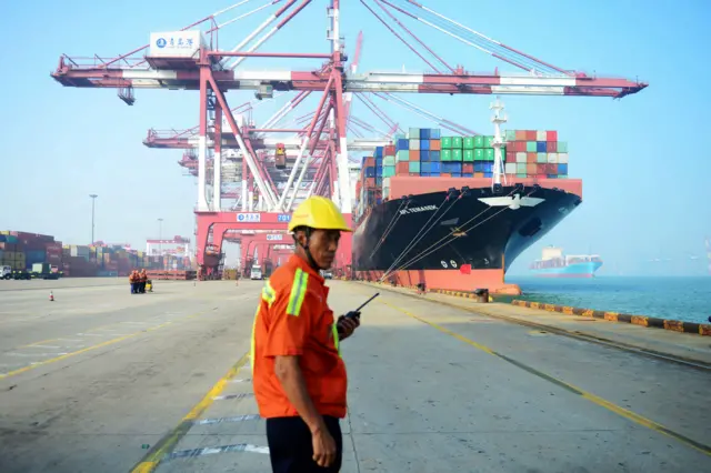 Man stands on a port in China