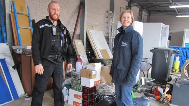 Police officer and Jo Wilkes with growing equipment