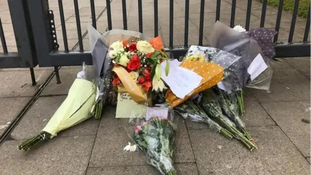 Floral tributes outside Joseph Chamberlain College earlier this month