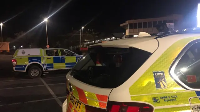 Police cars at the service station