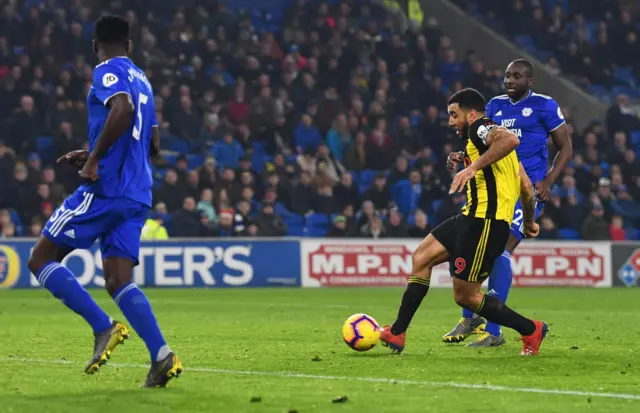 Troy Deeney of Watford scores