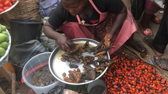 Woman selling cow skin