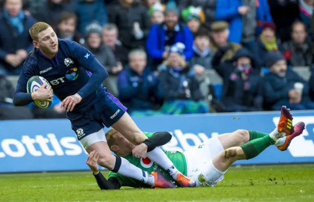 Finn Russell is tackled by Keith Earls