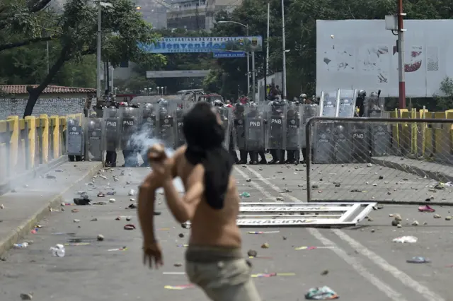 Demonstrators clash with Venezuelan national police at the Simon Bolivar bridge, in Cucuta, Colombia