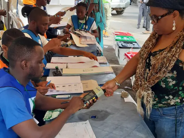 Voters checking card readers