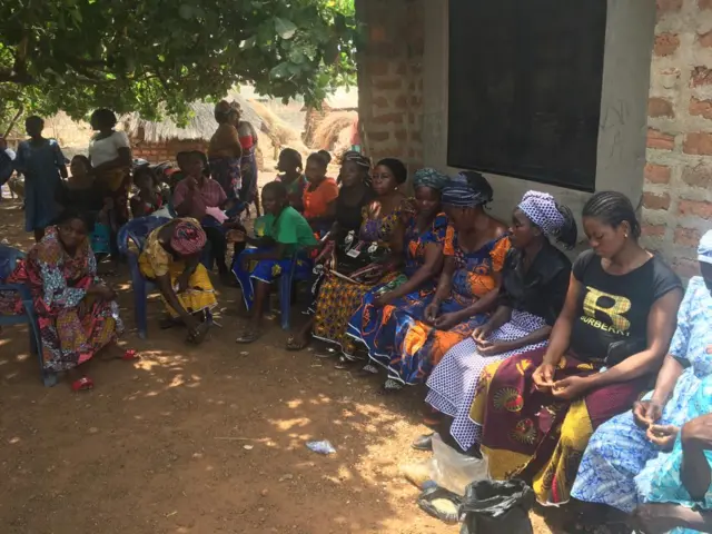 Voters waiting in the shade