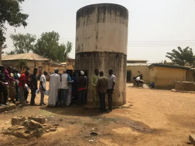 Small cylindrical concrete building