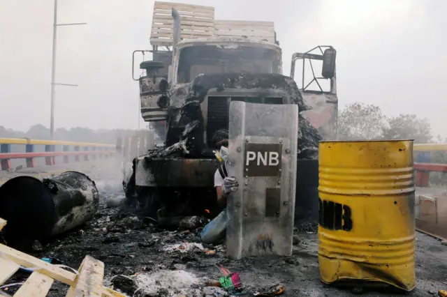 An opposition supporter looks on amid clashes with Venezuela's security forces at Francisco de Paula Santander bridge on the border with Colombia