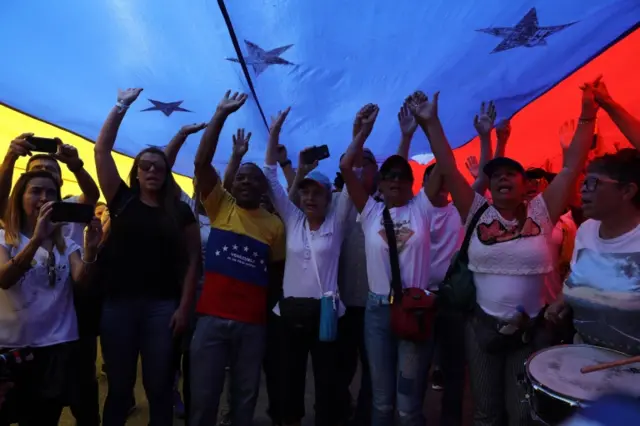 Opposition supporters march in Caracas