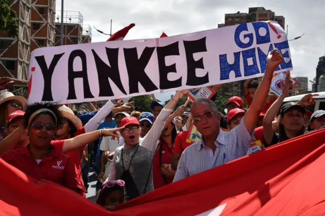 Maduro supporters in Caracas with a poster that reads "Yankee go home!"