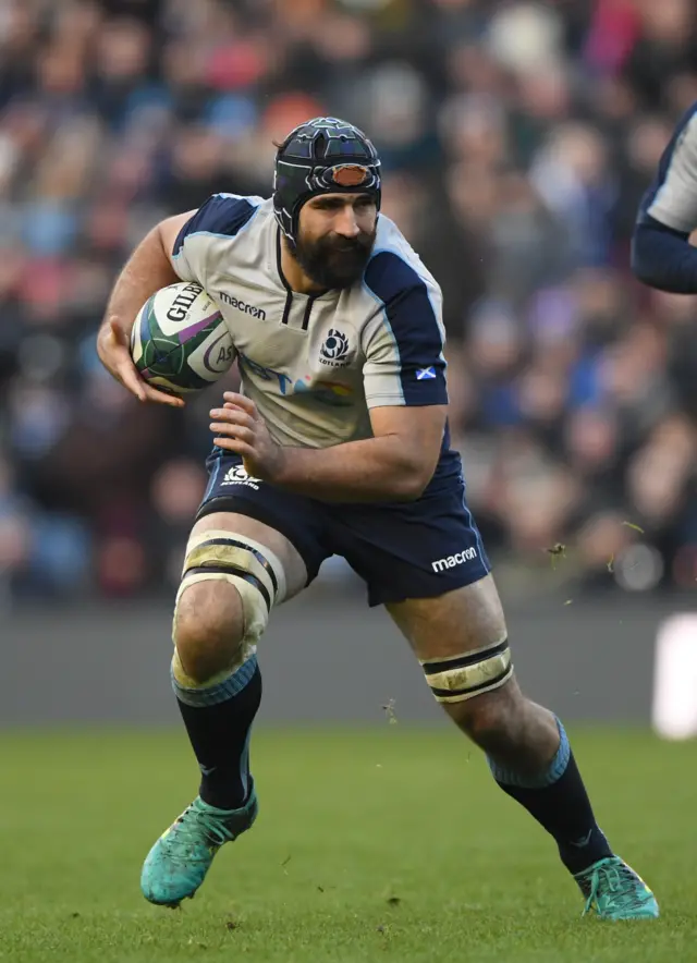 Josh Strauss carries the ball for Scotland against Italy