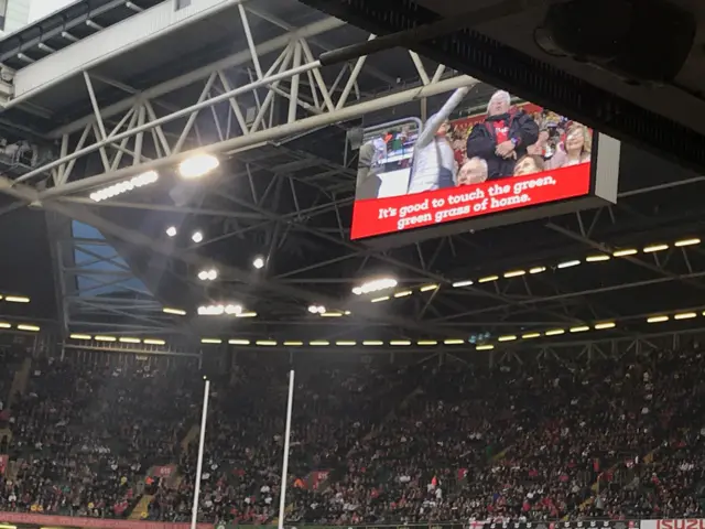 The big screen at the Principality with song lyrics