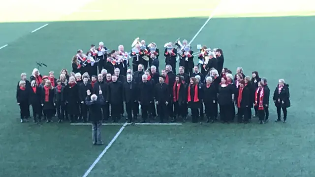 A choir on the pitch