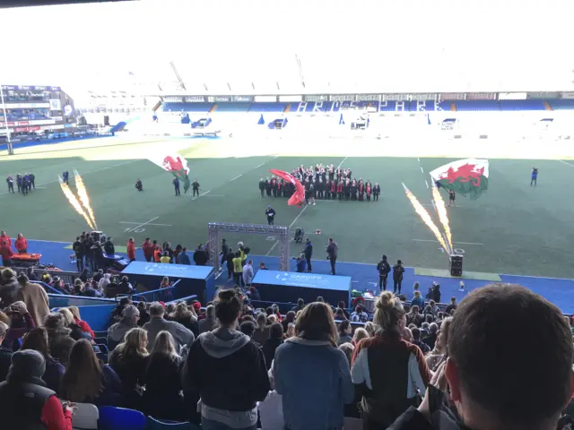 Flames shoot up in front of the pitch