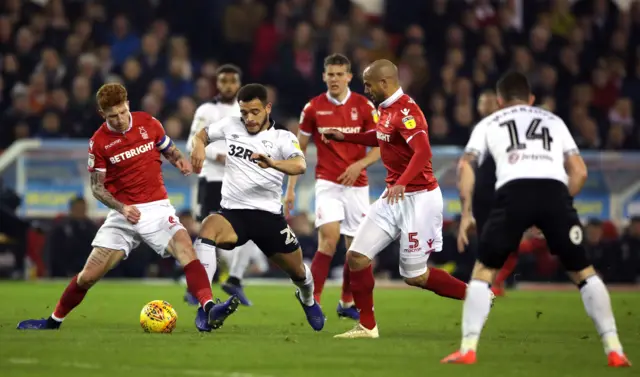 Nottingham Forest's Jack Colback (left) fouls Derby County's Mason Bennett