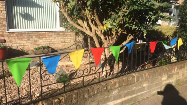 Rainbow bunting on railings