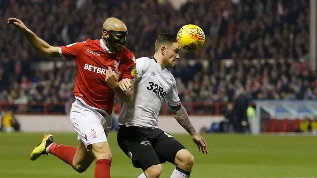 Nottingham Forest's Yohan Benalouane battles with Derby County's Jack Marriott