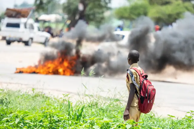 Boy looks at fire