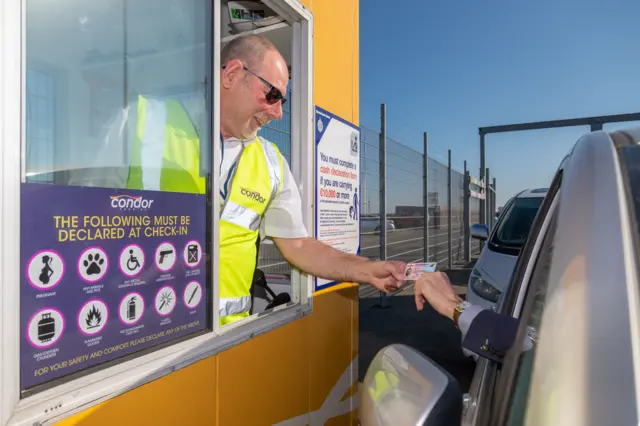 condor ferry man checks ID