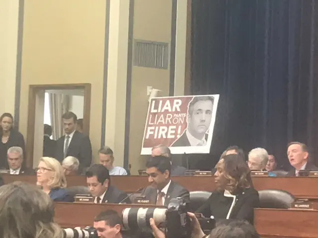 Republicans branded a 'liar, liar, pants on fire' poster during questioning