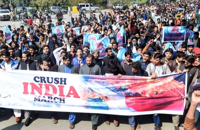 People hold banners during an anti-Indian protest in Lahore, Pakistan, 27 February 2019.