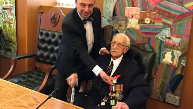 Herbert Thorpe receives his medal from Jean-Claude LaFontaine