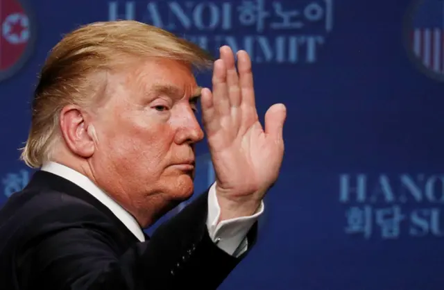 Donald Trump reacts during a news conference after his summit with North Korean leader Kim Jon-un