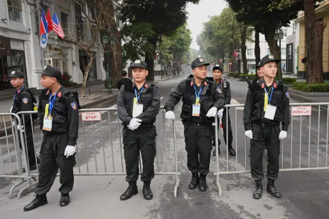 Vietnamese police stand guard