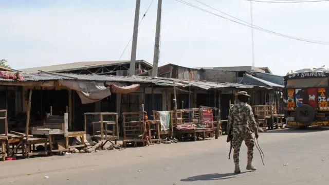 A soldier patrols the streets in Maiduguri, north-east Nigeria.