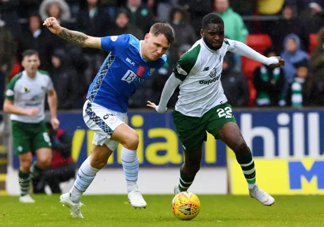 St Johnstone's Jason Kerr tussles for possession with Celtic striker Odsonne Edouard