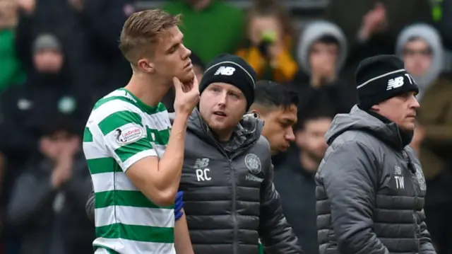 Celtic's Kristoffer Ajer nurses a sore chin