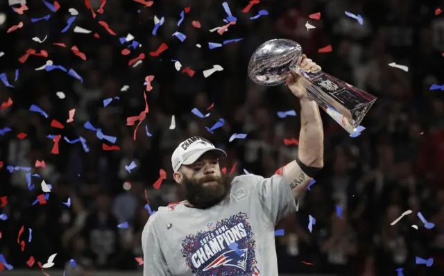 Julian Edelman lifts the trophy