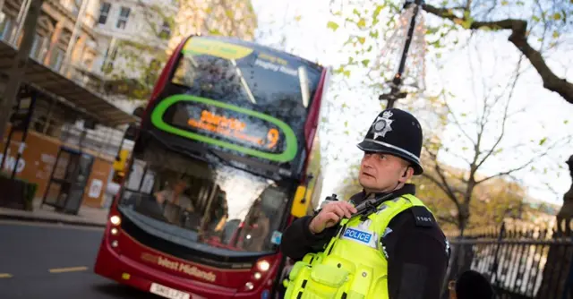 Police officer with bus