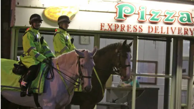 Oakwell the horse outside a pizza shop