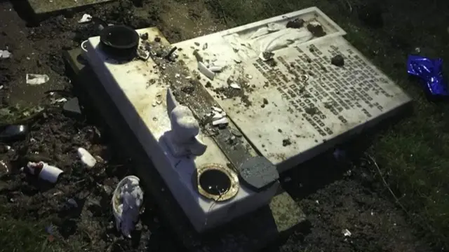 A headstone lying on the floor