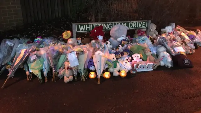 Tributes on the nearby street