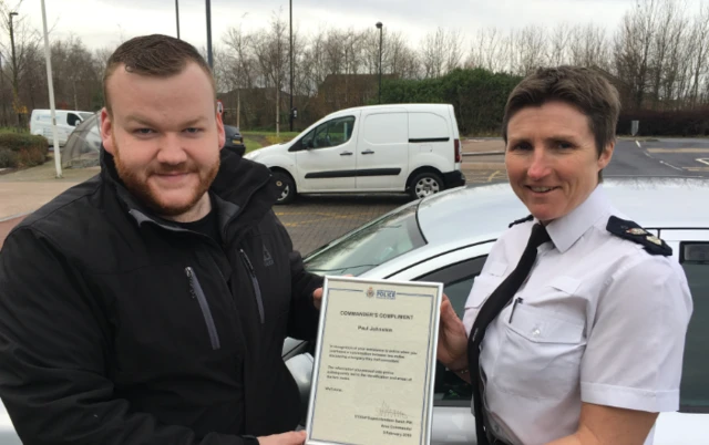 Taxi driver Paul Johnston with Chief Superintendent Sarah Pitt outside of Northumbria Police's Middle Engine Lane station