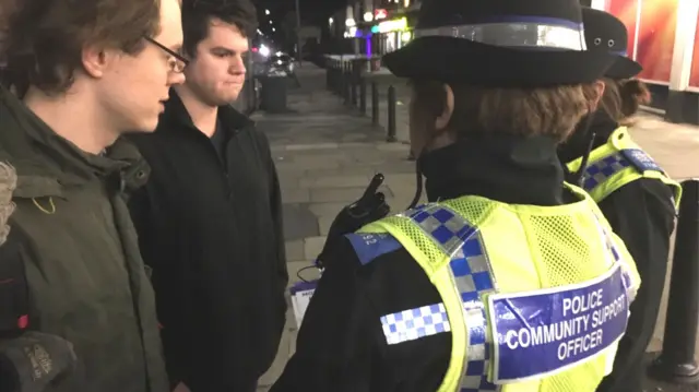 Police speaking to members of the public