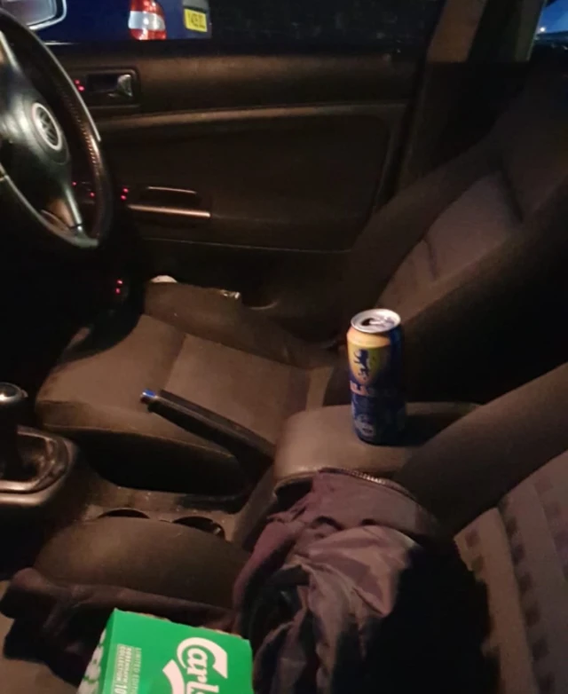 Beer can in front seat