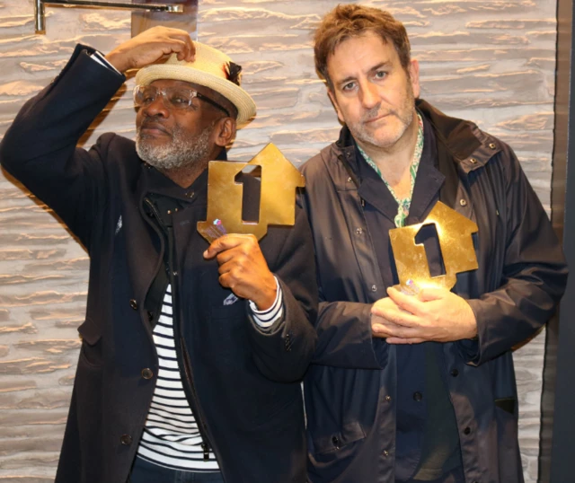 Lynval Golding and Terry Hall of The Specials with their Official Number 1 Album Award for Encore