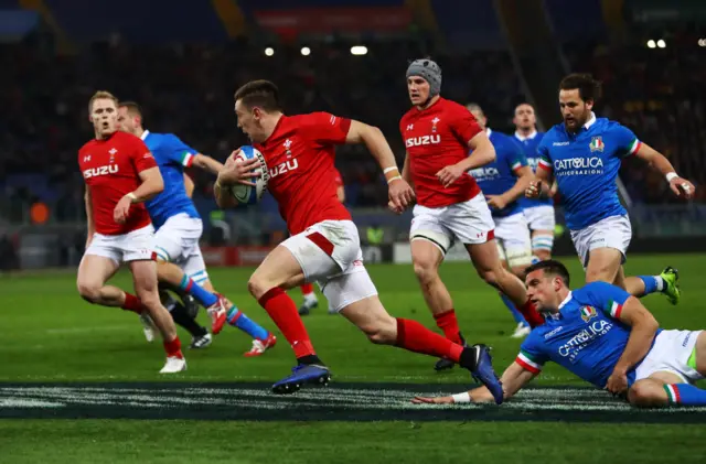 Josh Adams of Wales crosses to score their first try