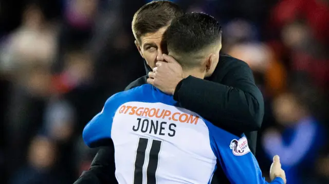 Jordan Jones gets a post-match cuddle from Steven Gerrard, who will be his boss next season