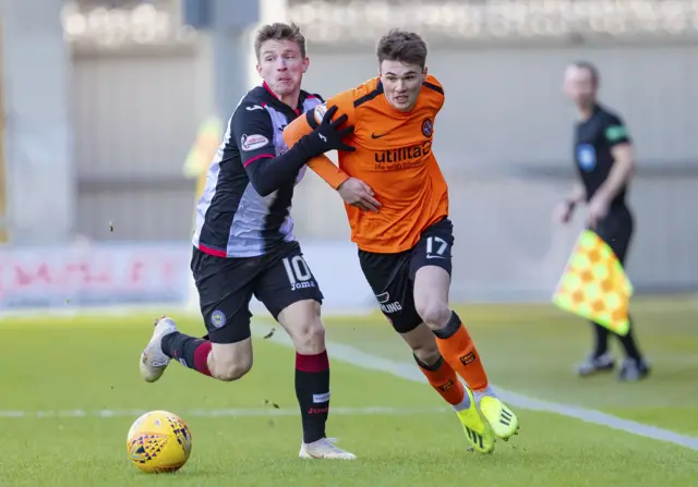 St Mirren's Anders Dreyer battles with Dundee United's Jamie Robson.